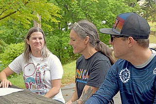 From left, Hot Springs Thoroughbreds head coach Suzanne Seale, coach Briana Moore and team director Thad Allen discuss the Girls Riding Together Fun Ride that will be held Saturday at 10 a.m. on the Northwoods Trails System. (The Sentinel-Record/Donald Cross)